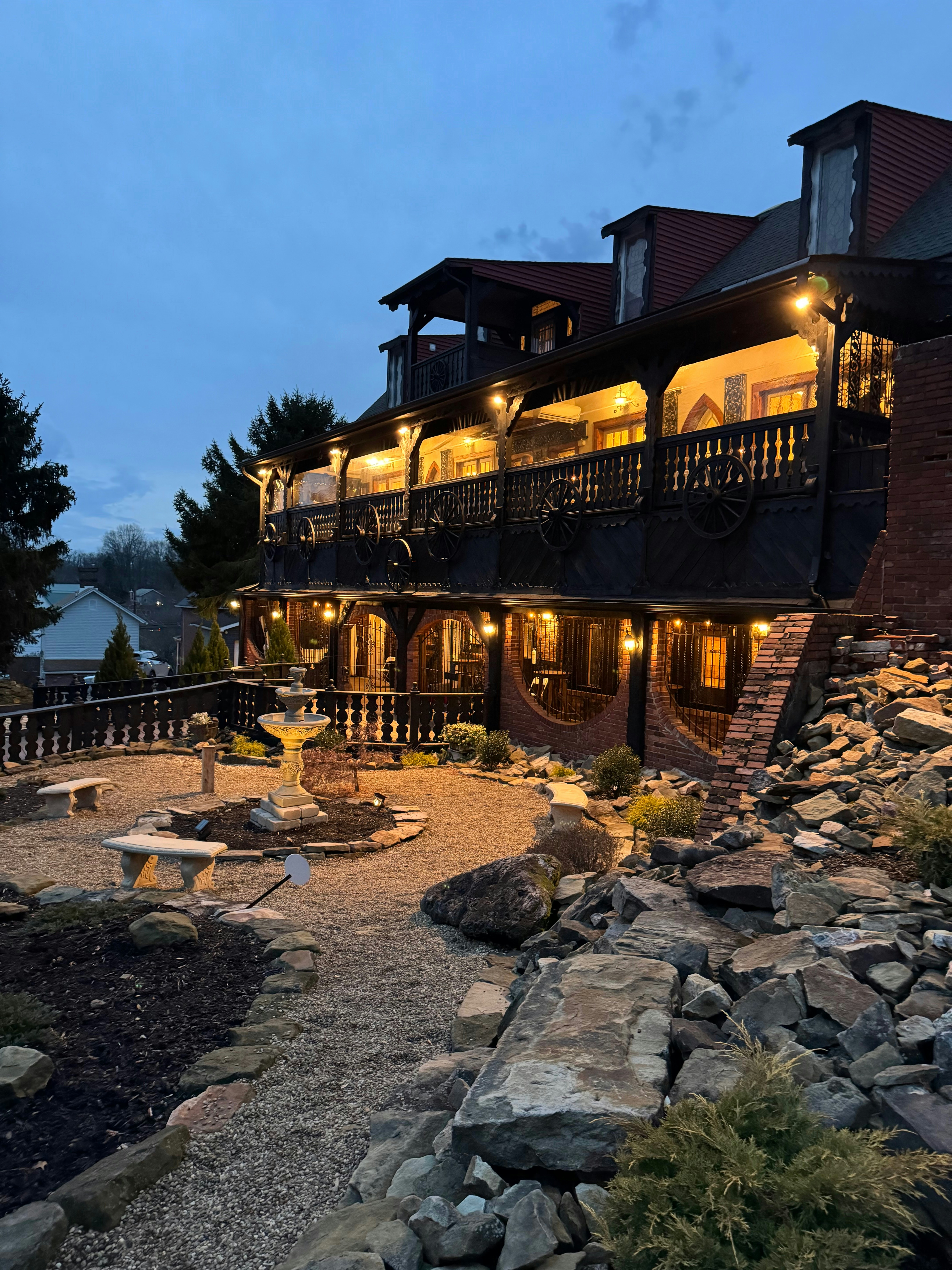 Tree trunk wrapped with golden Christmas lights